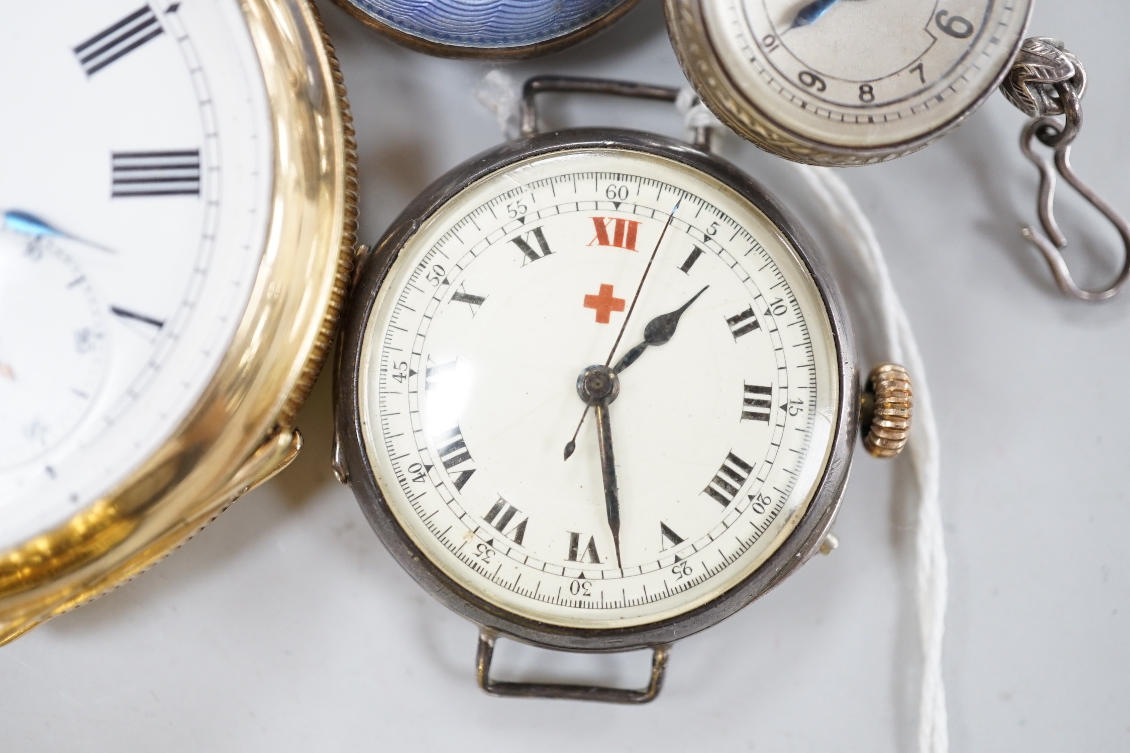 A gold plated open face pocket watch, a silver wrist watch, three fob watches including Art Nouveau 935 and enamelled and a globe watch.